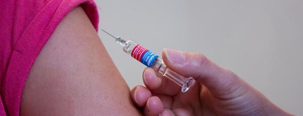 Closeup of someone receiving a vaccination