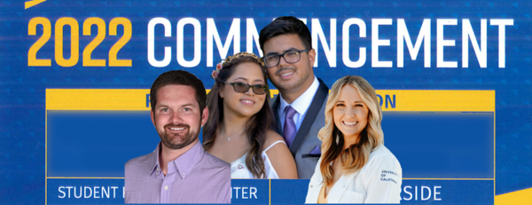 Biomed grads in front of a commencement sign