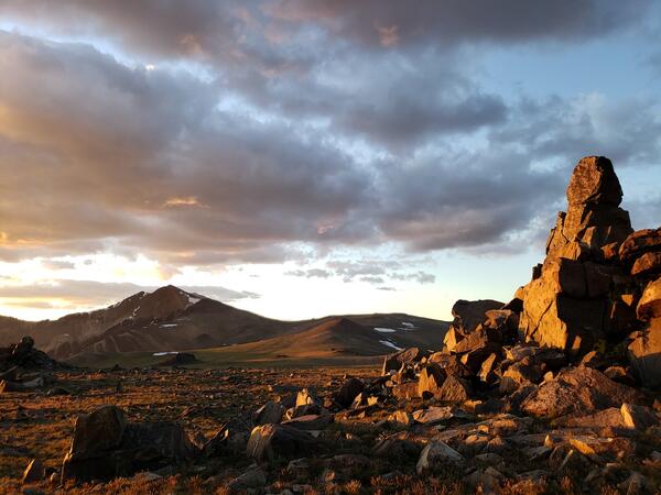 Rock formation with mountains in the distance