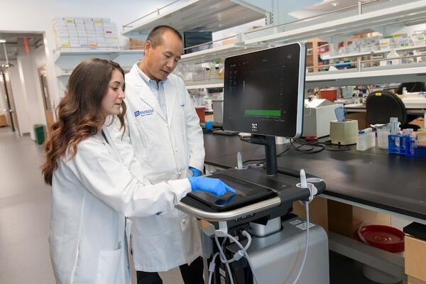 Rebecca Hernandez, left, with Dr. Changcheng Zhou