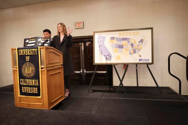 Abigail Burr and Alvin Chan at the podium