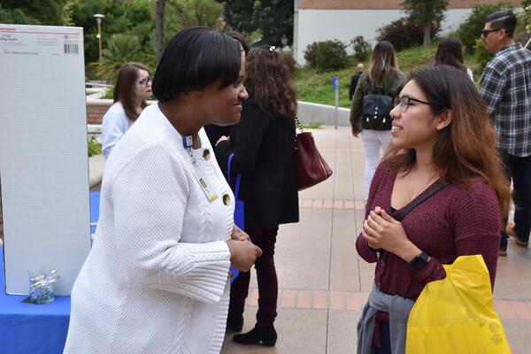 Teresa Cofield talking to a woman