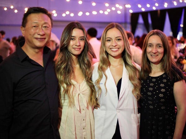 Aislyn Oulee and her family at the White Coat Ceremony in 2019.