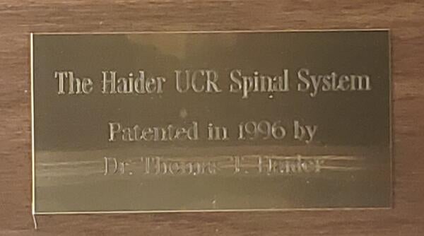 Pedicle Screw plaque that reads The Haider Spinal System - Patented in in 1996 by Dr. Thomas T. Haider