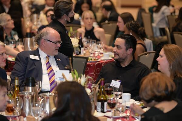 Jarrod McNaughton speaking to a student at the 2022 Gala