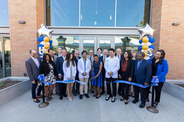 Dean Deas cuts the ribbon to open Ed II