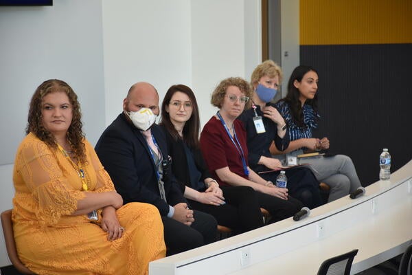 The panelists sitting during the event