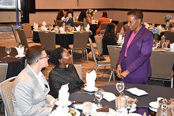 Dean Deas chatting with students at the awards ceremony