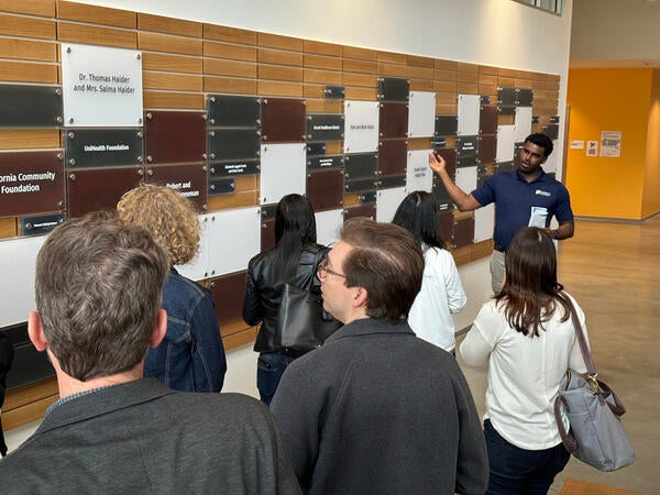 Vladimir Oge leads tour of guests at the SOM Ed II building