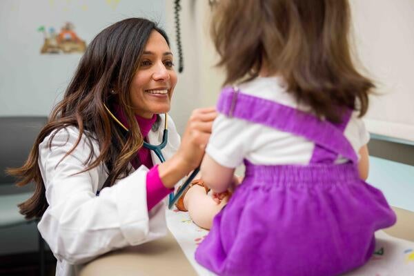 Dr. Khandhar treating a child