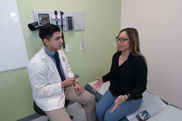 Resident speaking to a patient