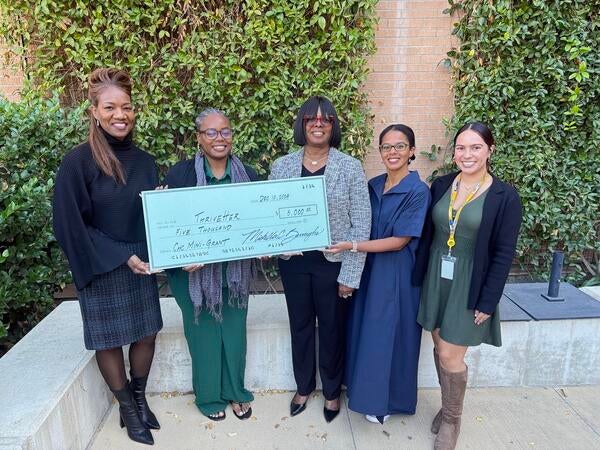 Winner of the Mini grant program being presented an oversized check
