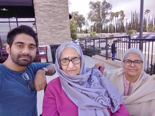 Anser Qazi (left), SOM class of 2025, with family