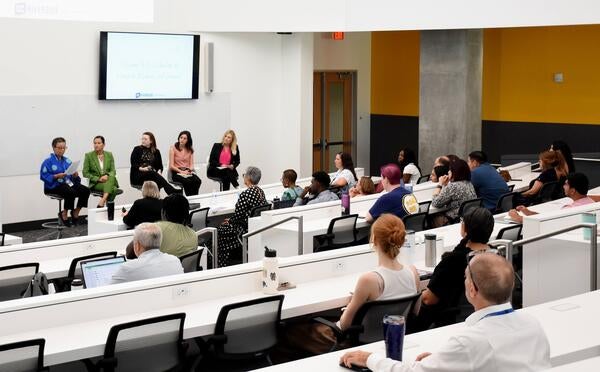 Audience watching the panelists at the WIMS 2025 event