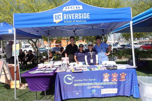 Joslyn Santana, far right, and others tabling for Unidas Por Salud