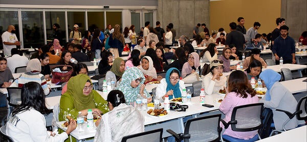 guests enjoy dinner at the Iftar celebration at the UCR School of Medicine