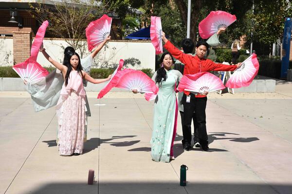 Students perform the fan dance at the SOM's Lunar New Year event