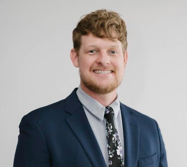 Andrew McLain in a blue suit