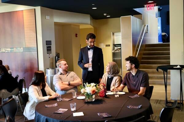 Moazzum Bajwa, MD, talks to student guests