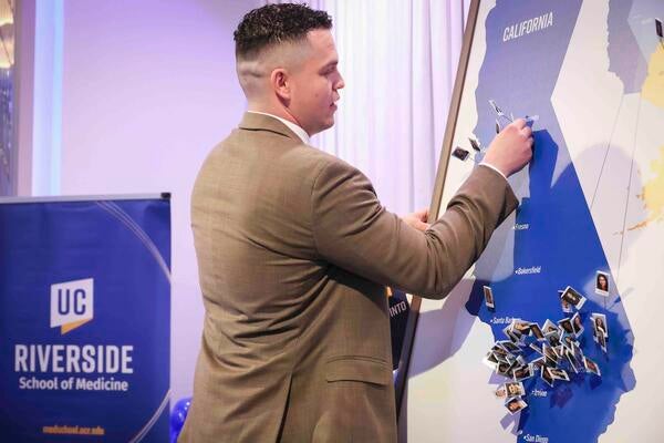 Javier Prieto putting a pin on the Match Day map