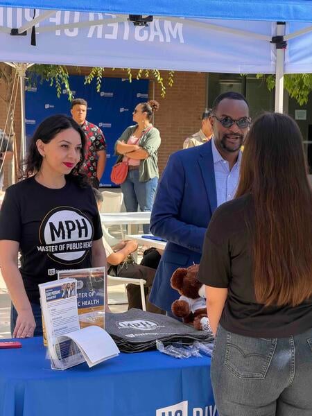 Talking to students at the MPH table at Open House 2026
