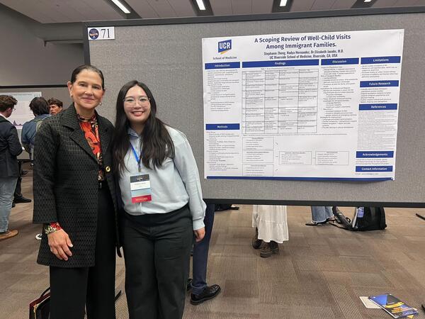 Stephanie Zheng standing in front of a research poster
