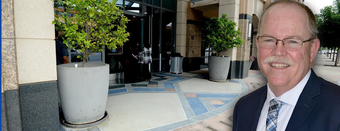 Tim Collins in front of the Citrus Tower lobby