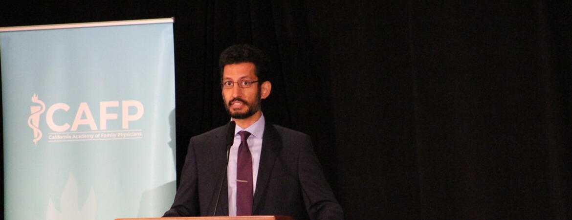 Moazzum Bajwa speaking - Photo by Sonia Olivarez