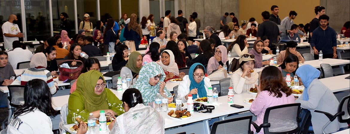 guests enjoy dinner at the Iftar celebration at the UCR School of Medicine