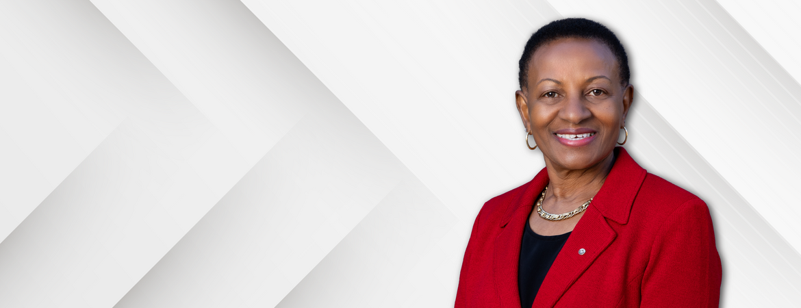 Deborah Deas in front of a checked background