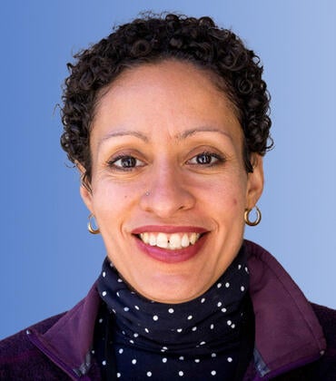 Lisa Fortuna in front of a blue background