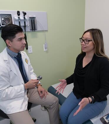Resident speaking to a patient