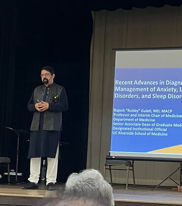 Rajesh "Robby" Gulati presenting at an event