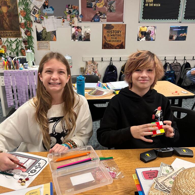 Two Craig School Students working at a table