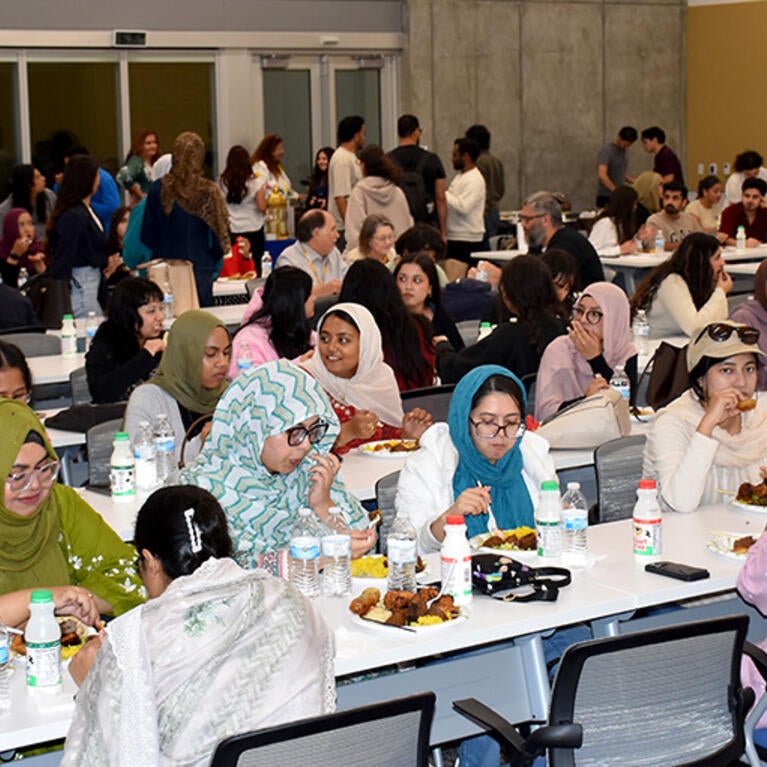 guests enjoy dinner at the Iftar celebration at the UCR School of Medicine