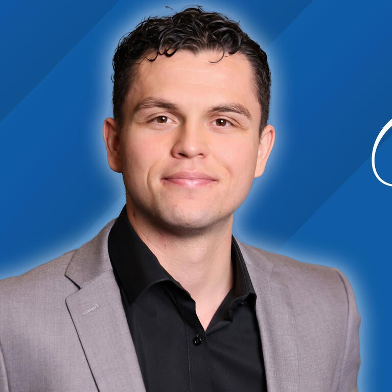 Headshot of Javier Prieto on a blue background next to text reading "Class of 2026"