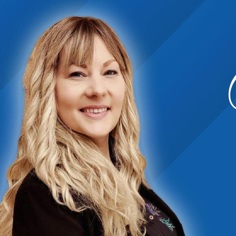 Headshot of Alicia Junker on a blue background next to text reading "Class of 2026"
