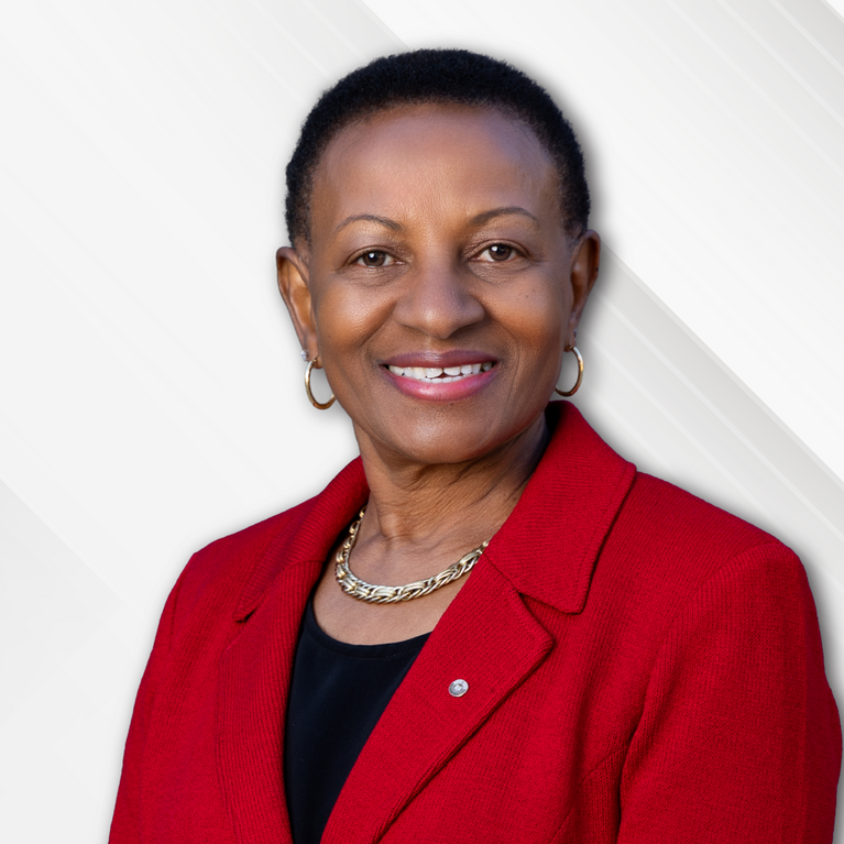 Deborah Deas in front of a checked background