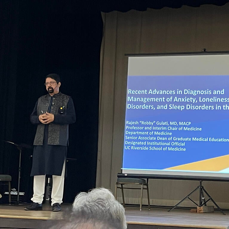 Rajesh "Robby" Gulati presenting at an event