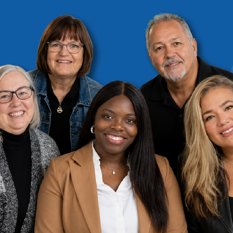 Office of Faculty Development group photo against a blue background