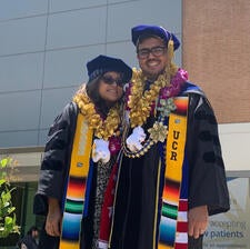 Stephanie Guardado and Edward Vizcarra after their hooding ceremony in June.