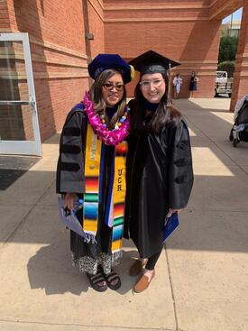 elena_guardado_hooding Elena Guardado with Dr. Erika Heinrich at her hooding ceremony.