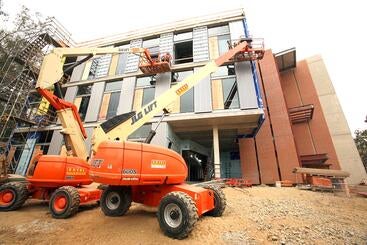 Lifts in front of the SOM Research building during construction.