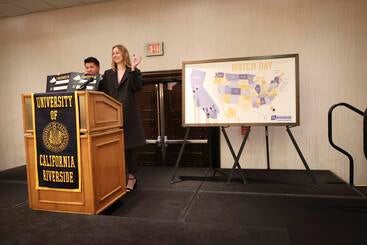 2023-matchday-abialvin Abigail Burr and Alvin Chan at the podium