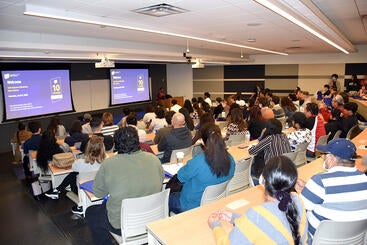 Dean Deas speaking to a full house at the 2023 Open House.