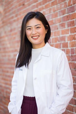 Dr. Yamaguchi in a white coat