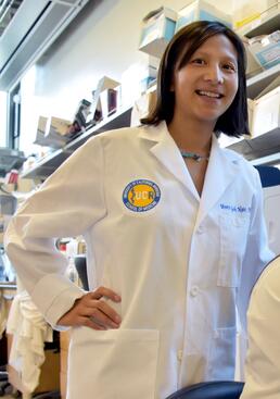 Meera Nair standing in her lab