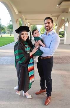 Violeta Covarrubias with her baby daughter and husband