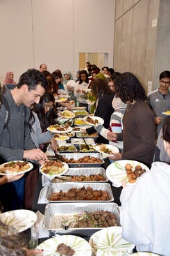 guests serving themselves at a buffet table