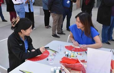 Attendees painted fans at the SOM's Lunar New Year event